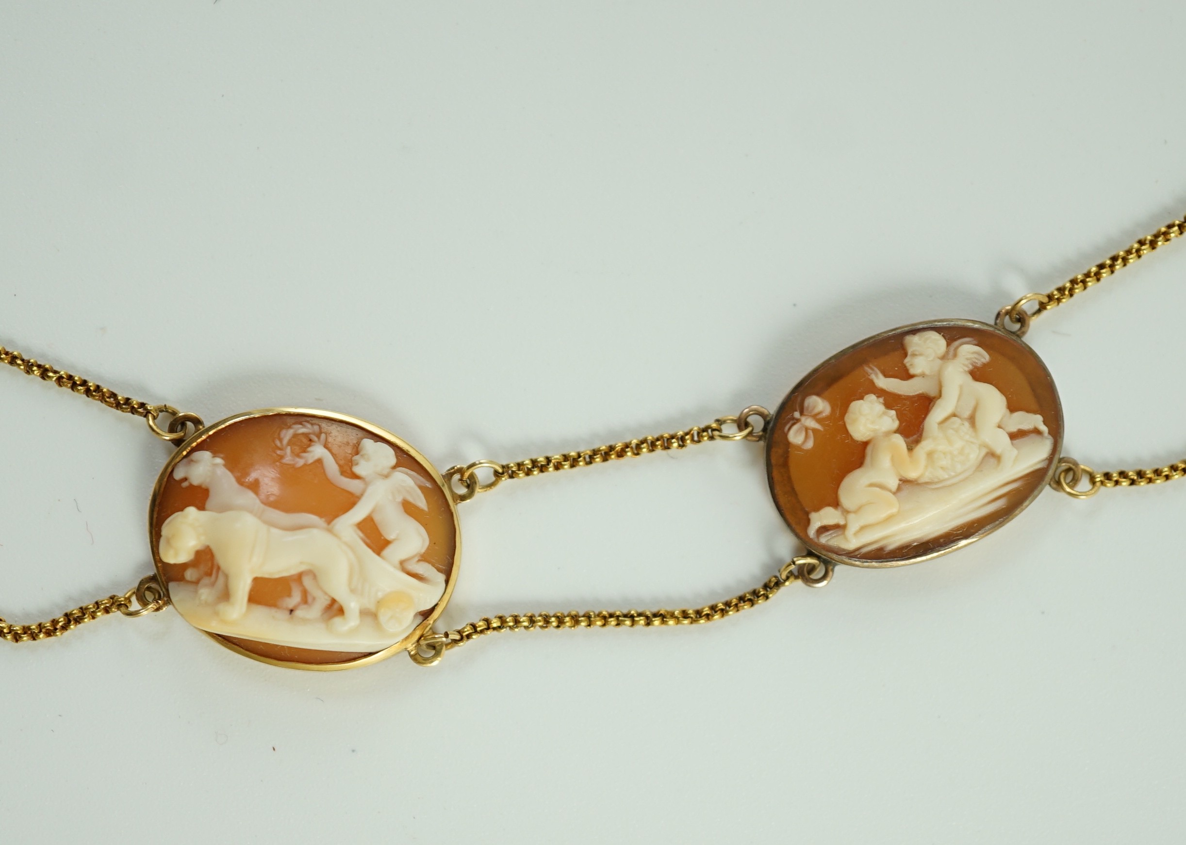 A late Victorian gold and graduated oval cameo shell necklace